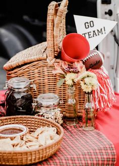 the picnic basket is set up on the table ready to be eaten and served for guests