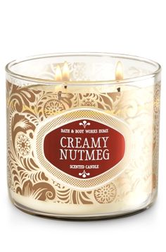 a candle that is sitting in front of a white background with the words creamy nutmeg on it