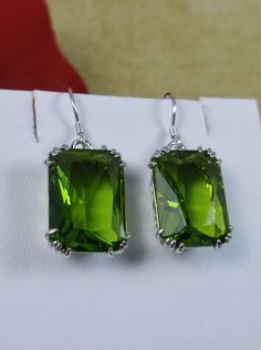 Peridot Earrings, Rectangle gem with sterling silver filigree, Art nouveau Jewelry Formal Rectangular Earrings With May Birthstone, Classic Green Drop Earrings, Emerald Cut Green Sterling Silver Earrings, Elegant Lime Green Sterling Silver Jewelry, Elegant Lime Green Jewelry For May Birthstone, Elegant Rectangular Hypoallergenic Jewelry, Elegant Hypoallergenic Rectangular Jewelry, Elegant Rectangular Emerald Earrings For May Birthstone, Elegant Lime Green Earrings For Formal Events