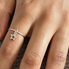 🌷This beautiful dainty handmade charm ring, will make a lovely Christmas gift for someone special. It can also be worn as a fidget ring, as the gorgeous little star charm can move around the ring band. This lovely ring looks beautiful on its own, or stacked with other rings. 🌷Your ring will be made to order in the size of your choice, so please choose your ring size from the drop down ring chart. 🌷Ring dimensions: 925 sterling silver 1.2mm gauge Star charm: 6mm 🌷Your ring will arrive gift wr Silversmithing Jewelry, Fidget Rings, Charm Rings, Star Ring, Handmade Rings, Handmade Charms, Lovely Ring, Dainty Ring, Star Charms