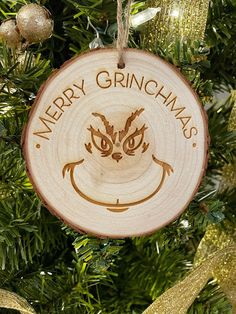 a wooden ornament hanging from a christmas tree