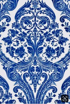 blue and white wallpaper with an ornate design