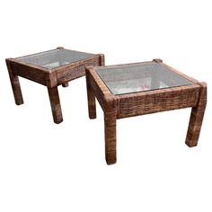 two wicker tables with glass tops on white background