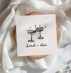 a napkin with two glasses drawn on it