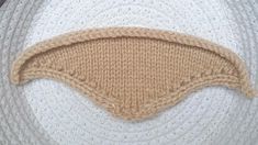 a piece of knitted material with a hole in the middle