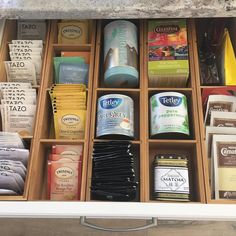 an open drawer filled with lots of different types of teas and other items in it