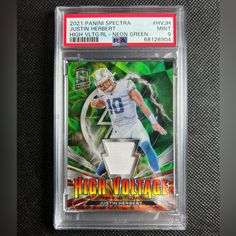 a football card that is on display in a plastic case with the name high voltage