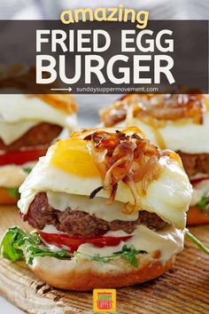 an egg burger on a wooden board with the words amazing fried egg burger over it