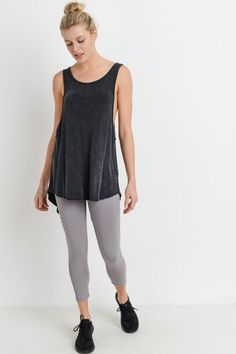 With its flowy silhouette as well as ellipse cut-out and dramatic notch on the back, this longline 'Creed' muscle tank is perfect to show off your favorite sports bra. Layer it over your activewear as you dash in and out. Black is mineral washed. All other colors are garment-dyed. Available in black. 95% rayon and 5% spandex. Imported. Black Sporty Sleeveless Muscle Tee, Black Compressive Activewear With Tank Straps, Black Sporty Moisture-wicking Muscle Tee, Compressive Solid Tank Activewear, Black Moisture-wicking Tank Top For Yoga, Back Muscle, Yoga Tank, Back Muscles, Muscle Tanks