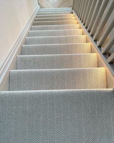 the stairs are lined with white carpet