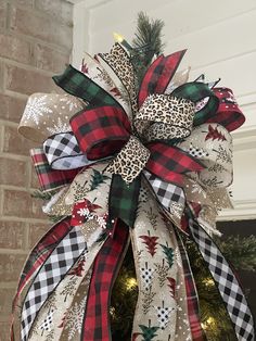 a christmas tree with a leopard print bow