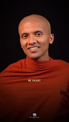 a bald man wearing an orange shirt with the words be silent on it