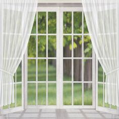 an open window with white curtains and green grass