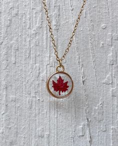 Enjoy the crisp fall leaves in any season, year round!  Beautiful dried mini punched maple leaf in resin in a small gold circular pendant on a 16" adjustable gold chain. Sure to give you those fall feelings any time you wear it! Makes wonderful bridal party, Christmas, Mother's Day, or birthday gifts for that special someone. Or buy as a treat to yourself! All jewelry is handmade by me especially for you. Each piece is unique and a one of a kind creation due to the individuality of natural flowers and resin. Flowers may not be identical and small bubbles may be present due to the resin. Please let me know if you have any questions. Enjoy! To preserve the life of your resin jewelry and keep it from tarnishing and discoloring, please remove before showering, swimming, or heavy exercise. Take Fall Leaves Resin, Adjustable Gold Necklace With Pressed Flowers, Gold Necklaces With Pressed Flowers And Adjustable Fit, Resin Leaves, Fall Necklaces, Thanksgiving Jewelry, Fall Necklace, Easy Crafts To Sell, Leaves Necklace