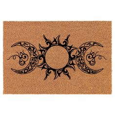 a door mat with an image of the sun and moon on it in black ink