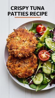 crispy tuna patties recipe on a white plate with cucumbers and tomatoes