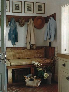 a living room filled with lots of furniture and pictures on the wall next to it