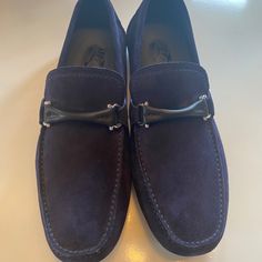 Nwot: Salvatore Ferragamo: Driver Moccasin Sz: 8 New, Unworn. No Packaging. Color: Navy Hardware: Silver W/Black Leather Made In: Italy Rubber Sole Suede Calfskin The Sophisticated Driver Mocassin In Suede Is Chic & Stylish. Formal Blue Moccasins With Suede Lining, Designer Formal Moccasins With Suede Lining, Salvatore Ferragamo Shoes, Ferragamo Shoes, Salvatore Ferragamo, Blue And Silver, Loafer Shoes, Moccasins, Calf Skin