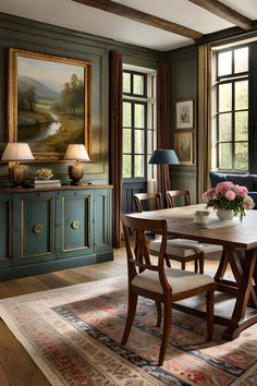 a dining room with green walls and wooden furniture, along with a painting on the wall