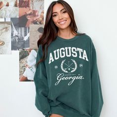 This Augusta Georgia Comfort Colors golf shirt or sweatshirt is the perfect outfit to wear at the country club this season. For a trendy oversized look, consider size up one or two sizes. For other colors for the word lover, message us.  Every item is custom produced, made to order, so please note each item is unique and may differ in color slightly from photos, which is what makes every item special. If you have any issues, don't hesitate to reach out to us through messaging . We strive to make sure you're happy with what we deliver. -This Comfort Colors Sweatshirt is garment dyed and  made to look vintage with a distressed inspired style.  ------------------------------------------------------------------------ Luxurious comfort and style are what this unisex, garment-dyed sweatshirt is Casual Tops For Golf In Fall, Sporty Tops For Golf In Fall, Sporty Golf Tops For Fall, Preppy Crew Neck Top With Graphic Print, Preppy Graphic Print Crew Neck Top, Casual Golf Sweatshirt With Crew Neck, Preppy Crew Neck Top For College, Sporty Long Sleeve Sweatshirt For Golf, Casual Long Sleeve Golf Tops