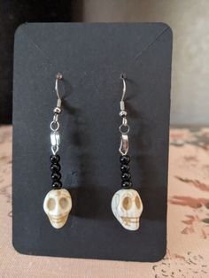 Skull beads on stainless steel french wire. Will include rubber backing. Nickel Free Black Skull Earrings, Adjustable Black Skull-shaped Earrings, Adjustable Black Skull Earrings, Handmade Casual Halloween Jewelry, Casual Handmade Halloween Jewelry, Casual Handmade Jewelry For Halloween, Casual Skull Jewelry For Halloween, Casual Halloween Skull Jewelry, Casual Skull-shaped Jewelry Gift