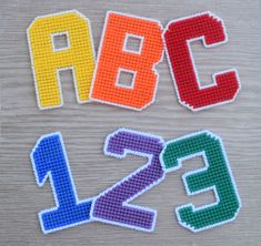 the letters are made out of plastic beads