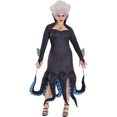 a woman in a costume with an octopus on it's head and legs, standing next to a white background