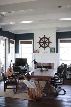 a living room filled with furniture and a fire place