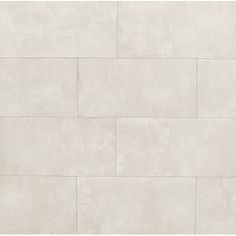 a white tile wall that has been painted in shades of gray and beige with different colors