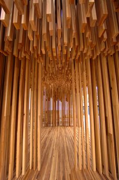 a room with wooden walls and flooring that looks like it is made out of sticks