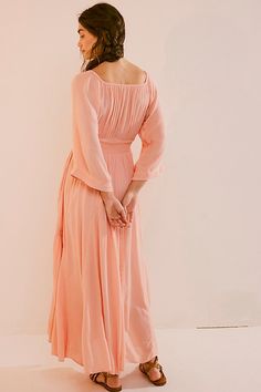 Romantic and ethereal, this sweet maxi from our free-est collection is a true versatile staple. **Fit:** Billowy throughout with cinched waist **Features:** V-neckline, smocked paneling at bodice, exaggerated sleeves, embroidered lace piecing at the skirt **Why We ❤ It:** Timeless with a sleek heel or laid back with simple flats, this style has endless ways to wear. | Dixie Maxi Dress by free-est at Free People in Pink, Size: S Feminine Floor-length Ruched Maxi Dress, Feminine Ruched Floor-length Maxi Dress, Feminine Smocked Bodice Maxi Dress, Flowy Maxi Dress With Gathered Waist, Elegant Pink Maxi Dress With Smocked Back, Feminine Ruched Maxi Dress For Brunch, Flowy Maxi Dress With Gathered Waist For Brunch, Exaggerated Sleeves, Pink Fits