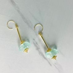 We think you'll love the light weight, unique design of our Aegean Sea Glass Earrings 🌊 Sea glass nuggets in translucent light blue sandwiched between our champagne gold hardware. All metals are copper based with a champagne gold tone electroplate and tarnish resistant finish, free from cadmium, lead, and nickel. Earrings measure 2.5 long. Champagne Gold Hardware, Beaded Jewelry Necklaces, Glass Drop Earrings, Sea Glass Earrings, Aegean Sea, Custom Jewelry Design, Champagne Gold, Glass Earrings, Sea Glass