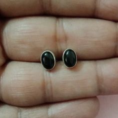 Price per pair. Ready To Gift Packaging.  Stone size is 7mm(L) by 5mm(W).  Gemstone is Natural. Black Onyx Oval Earrings, Black Oval Handmade Earrings, Earrings Minimal, Onyx Earrings, Stone Studs, Sterling Silver Studs, Silver Studs, Gift Packaging, Jewelry Earrings Studs