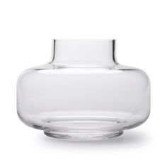 a clear glass vase sitting on top of a table