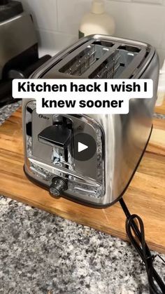 a toaster sitting on top of a wooden cutting board