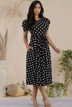 This polka dot print dress is a stunning addition to any wardrobe. The crew neckline and short puff sleeves give it a playful and feminine touch, while the midi length and waist tie provide a flattering silhouette. The dress is made of a combination of polyester and spandex, making it comfortable to wear and easy to move around in. The sleeves are 3/4 in length, perfect for any season. The back zipper closure and side pockets add practicality to this stylish dress. **PLEASE NOTE**This item requi Casual Short Sleeve Polka Dot Midi Dress, Casual Polka Dot Midi Dress With Short Sleeves, Dot Print Dress, How To Make Light, Maxi Wrap Dress, Polka Dot Print, Dot Print, Stylish Dresses, Waist Tie