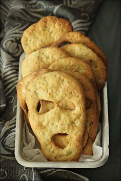 some crackers in a white container on a table