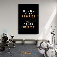 a gym room with exercise equipment and a quote on the wall above it that says, my goal is to progress not to imppress