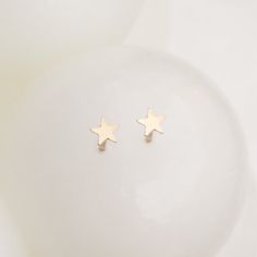 Crafted with high-quality materials, these Tiny Gold Star Earrings the so cute and versatile, making them an ideal gift for a loved one or a special treat for yourself. The lightweight and comfortable design ensures you can wear them all day, every day, without compromising on style or comfort. [details] - Materials: 14k gold-filled- Small Stud Earrings - Color: Gold- Dimensions: 3mm (tiny and adorable)- Comfortable and lightweight- Water-friendly- Hypoallergenic (No nickel, lead or weird coatin Gold Heart Stud Earrings, Gold Star Earrings, Star Earring, Gold Heart Studs, Small Stud Earrings, Karma Necklace, Tiny Hoop Earrings, 2 Earrings, Moon Studs