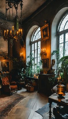 Gothic decor, lush dark leafy indoor plants, gilt framed oil paintings, lots of candles, dark antique furniture, natural rugs and vintage velvet armchair Dark Maximalism Decor, Vintage Gothic Furniture, Southern Gothic Decor Interior Design, Dark Naturalism House Interior, Dark Plant Aesthetic, Gothic Cabin, Moody Mansion, Cottagecore Interior Design, Cottagecore Interior