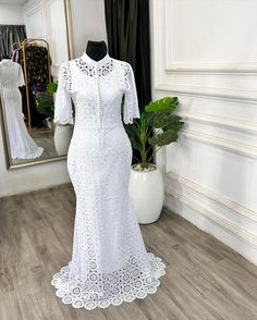 Dainty and delicate! This understated yet stunning bespoke dress for the Teramarg woman embodies soft femininity. Featuring a white cord lace fishtail design with a bishop collar, adorned with pearl buttons down the center bodice and bell sleeves. Perfect for making an elegant statement. Reach us on⬇️ ✅Click on the link on our bio to chat with us on WhatsApp ✅Send us a dm ✅Call us on 08103672667 ——————————————————— . . . . . . . . . . . . . . . . . . . . . . . . . #ankaradress #pre... White African Lace Styles, Bishop Collar, Bespoke Dress, Cord Lace, Lace Styles, Ankara Dress, Baby Christening, African Lace