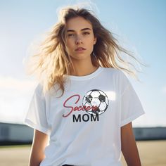 Score big laughs and style points with our Soccer Futbol Mom Tee! This Stylish Motherhood Shirt is more than just Sporty Mom Life Apparel--it's the perfect blend of comfort and kickin' it on the sidelines with a touch of trendy football fan flair. The ideal gift for Soccer Moms who tackle goals and tantrums with equal finesse! This classic unisex jersey short sleeve tee fits like a well-loved favorite. Soft cotton and quality print make users fall in love with it over and over again. These t-shirts have-ribbed knit collars to bolster shaping. The shoulders are tapered for a better fit over time. Dual side seams hold the garment's shape for longer.  .: This t-shirt comes with a lightweight fabric (4.2 oz/yd² (142 g/m that is easy to layer thanks to its breathability and the perfect choice f White Relaxed Fit Sports Fan T-shirt, White Relaxed Fit T-shirt For Sports Fans, White Sports Fan T-shirt Relaxed Fit, Sporty Crew Neck With Sublimation Text Print, Casual Sublimation Design For Football Season, Casual Sports Sublimation Design With Letter Print, Relaxed Fit Letter Print T-shirt For Football Season, White Casual T-shirt For Football Season, Casual White T-shirt For Football Season