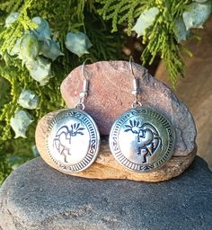 Stunning pair of Vintage Native American Sterling Silver Earrings. These sterling silver earrings have a dome circle shape, these resemble overlay with the silver being raised, but they look like the design is black enamel and not oxidized. These are stamped Sterling on the back of earrings.  They are in very good vintage condition. The earring hooks are new but are silver plated. From Top of ear wire to bottom of Earring is 1 3/4" long by 1" at widest part.   Weight Measures 8.81 In Grams. Weig Vintage Native American Jewelry, Satin Bags, 925 Jewelry, Circle Shape, Native American Jewelry, Black Enamel, Sterling Silver Earrings, Silver Earrings, Favorite Jewelry