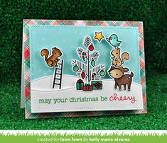 a christmas card with some animals and trees on it in the grass next to green grass