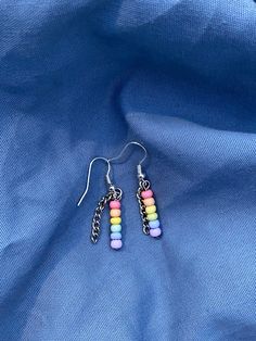 Handmade pastel rainbow bead earrings, silver or black chain. A great gift for you or your LGBT+ family! I ship all orders within 1-3 days, and make sure to package orders carefully to prevent problems during delivery. If there are any problems with your order just message me and I'll be sure to accommodate as much as I can. Rainbow Dangle Earrings For Everyday, Cute Rainbow Dangle Earrings, Trendy Rainbow Dangle Jewelry, Cute Multicolor Beaded Dangle Earrings, Trendy Rainbow Hypoallergenic Earrings, Minimalist Multicolor Dangle Earrings, Gay Earrings, Package Orders, Alternative Earrings