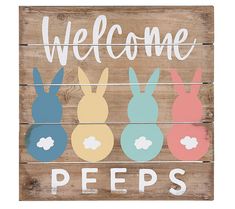 a wooden sign that says welcome peeps with four bunnies painted on the front