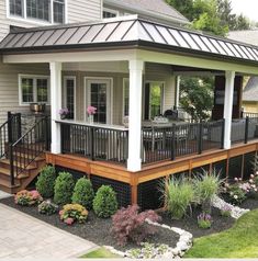 a small house with a deck and covered patio