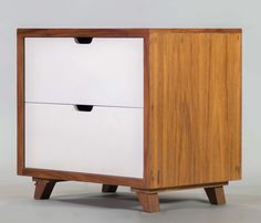 a white and wood cabinet with two drawers