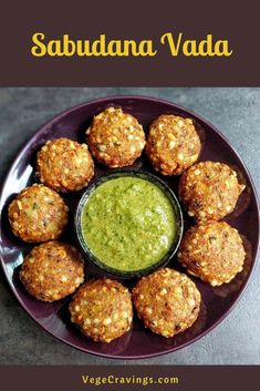 a purple plate topped with meatballs next to a green dipping sauce on top of it