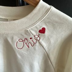 -Supersoft Pullover Sweatshirt With Ribbed Cuffs -Relaxed Fit -Falls Right At The Hip -52% Airlume Cotton, 48% Polyester Fleece -Bella Canvas Antique White Sweatshirt With Red Ohio Heart Embroidery Around Neck Long Sleeve Tops With Embroidered Logo For Loungewear, Long Sleeve Top With Letter Embroidery For Loungewear, Long Sleeve Top With Embroidered Text For Loungewear, White Custom Embroidered Tops For Loungewear, Cotton Tops With Letter Embroidery For Loungewear, Cotton Tops With Embroidered Logo For Loungewear, Red Long Sleeve Top With Letter Embroidery, Ohio Embroidery, Diy Embroidery Gifts